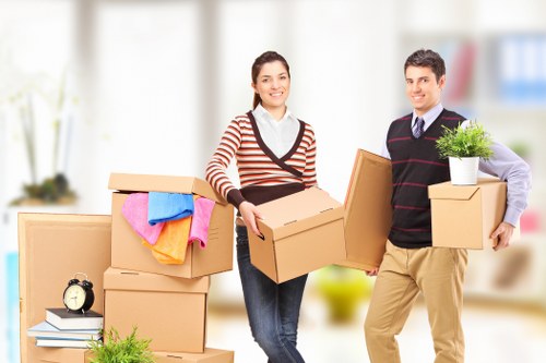 Local movers planning a home removal in St Pancras with boxes and furniture