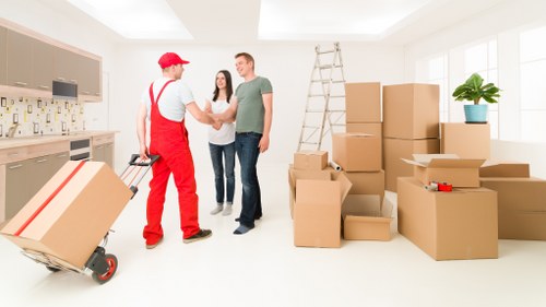 Packed household boxes and furniture ready for local removal