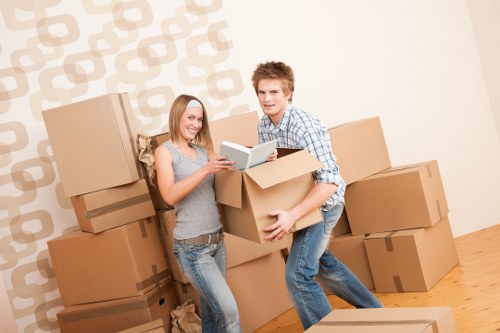 Packed moving boxes and furniture ready for collection in St Pancras
