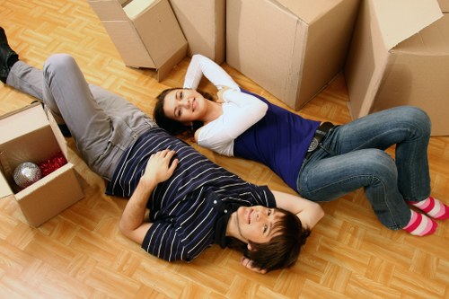 Careful lifting of a sofa during local furniture pick-up